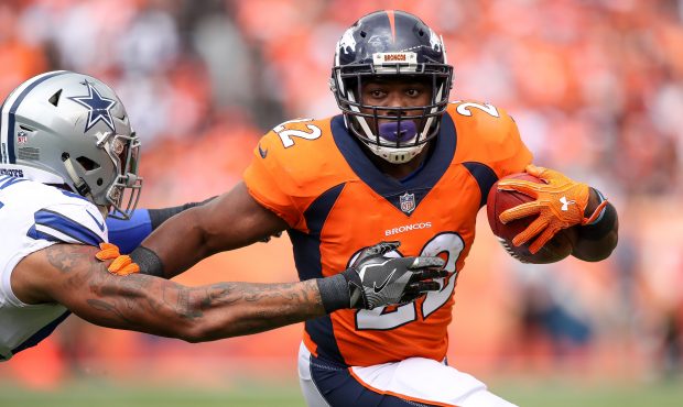 DENVER, CO - SEPTEMBER 17:  Running back C.J. Anderson #22 of the Denver Broncos rushes against the...