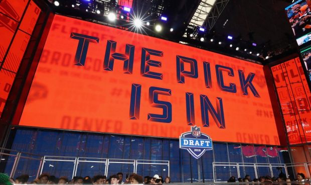 A video board displays the text "THE PICK IS IN" for the Denver Broncos during the first round of t...
