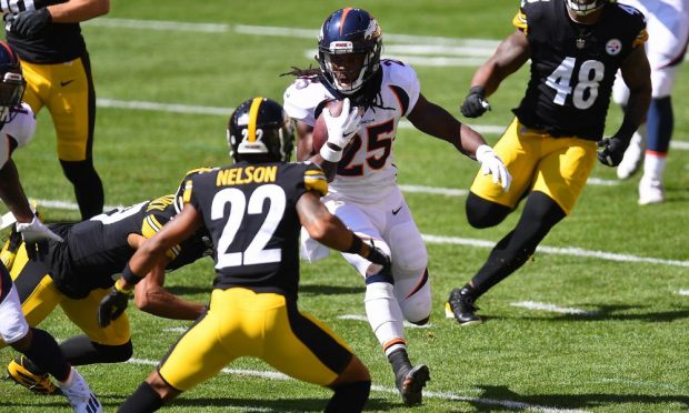 Melvin Gordon #25 of the Denver Broncos carries the ball in front of Steven Nelson #22 of the Pittsburgh Steelers during the first quarter at Heinz Field on September 20, 2020 in Pittsburgh, Pennsylvania. (Photo by Joe Sargent/Getty Images)