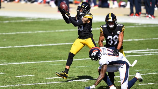 PITTSBURGH, PA - SEPTEMBER 20: Joe Haden #23 intercepts a pass in front of Minkah Fitzpatrick #39 of the Pittsburgh Steelers and Courtland Sutton #14 of the Denver Broncos during the second quarter at Heinz Field on September 20, 2020 in Pittsburgh, Pennsylvania. (Photo by Joe Sargent/Getty Images)