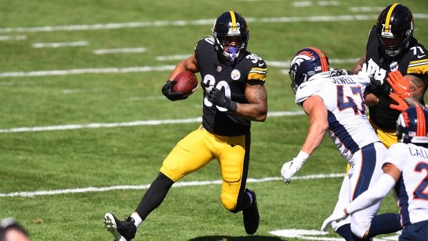 PITTSBURGH, PA - SEPTEMBER 20: James Conner #30 of the Pittsburgh Steelers carries the ball in front of Josey Jewell #47 of the Denver Broncos during the second quarter during at Heinz Field on September 20, 2020 in Pittsburgh, Pennsylvania. (Photo by Joe Sargent/Getty Images)