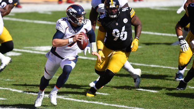PITTSBURGH, PA - SEPTEMBER 20: Jeff Driskel #9 of the Denver Broncos looks to pass in front of Isaiah Buggs #96 of the Pittsburgh Steelers during the third quarter at Heinz Field on September 20, 2020 in Pittsburgh, Pennsylvania. (Photo by Joe Sargent/Getty Images)