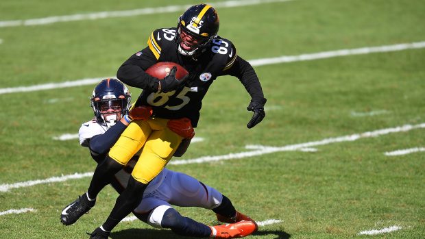 PITTSBURGH, PA - SEPTEMBER 20: Eric Ebron #85 of the Pittsburgh Steelers is dragged down by Justin Simmons #31 of the Denver Broncos during the fourth quarter at Heinz Field on September 20, 2020 in Pittsburgh, Pennsylvania. (Photo by Joe Sargent/Getty Images)