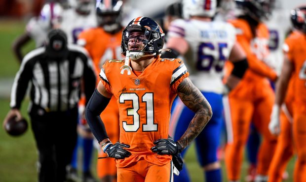 DENVER, CO - DECEMBER 19: Denver Broncos safety Justin Simmons (31) reacts after a defensive penalt...