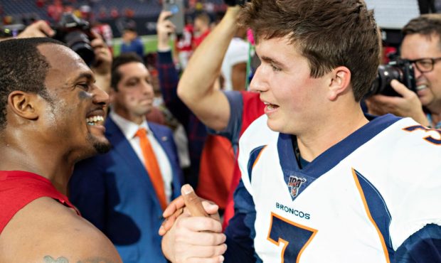 HOUSTON, TX - DECEMBER 8: Drew Lock #3 of the Denver Broncos shakes hands after the game with Desha...