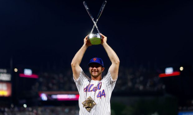 DENVER, COLORADO - JULY 12: Pete Alonso #20 of the New York Mets celebrates with the trophy after w...