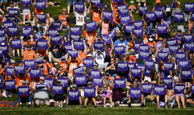 ENGLEWOOD, CO - AUGUST 04: Denver Broncos fans hold purple towels in honor of Alzheimer's Awareness...