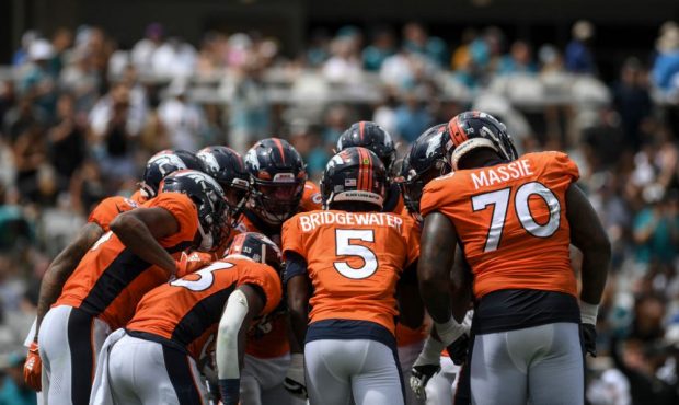 JACKSONVILLE , FL - SEPTEMBER 19: Teddy Bridgewater (5) of the Denver Broncos huddles his troop on ...