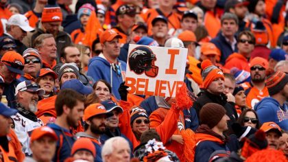 DENVER, CO - JANUARY 24: A Denver Broncos fan holds a sign in the first half of the AFC Championshi...