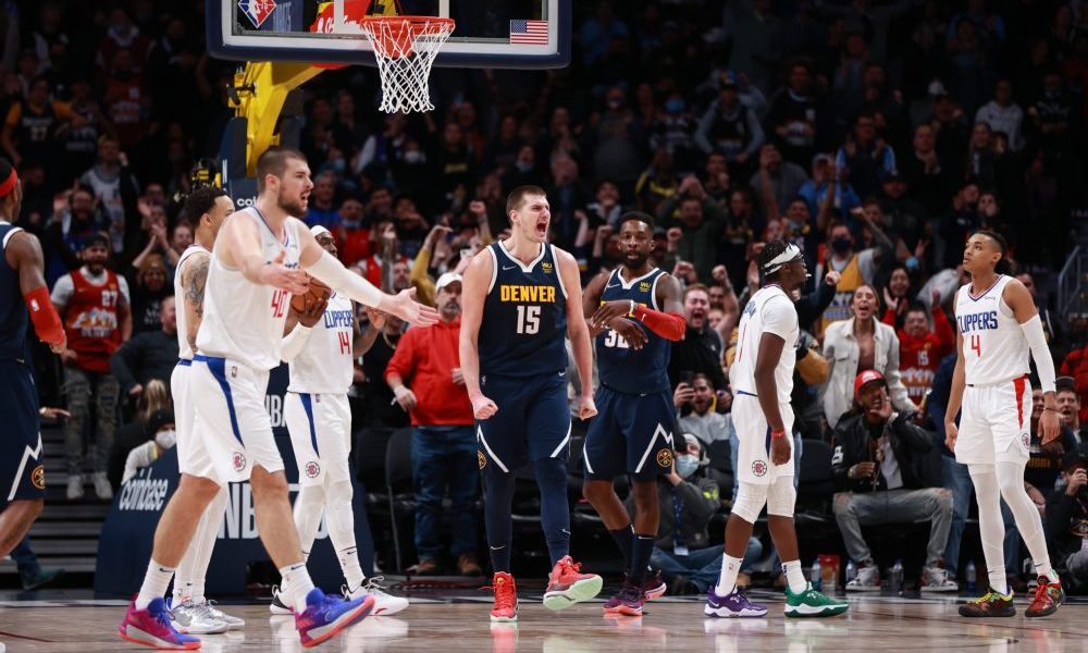 DENVER, CO - JANUARY 19: Nikola Jokic #15 of the Denver Nuggets reacts to a play against the Los An...