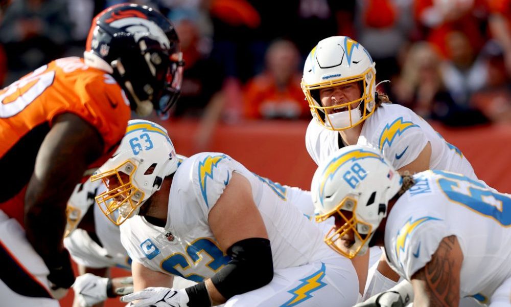 DENVER, COLORADO - NOVEMBER 28: Quarterback Justin Herbert #10 of Los Angeles Chargers lines up against the Denver Broncos at Empower Field At Mile High on November 28, 2021 in Denver, Colorado. (Photo by Matthew Stockman/Getty Images)