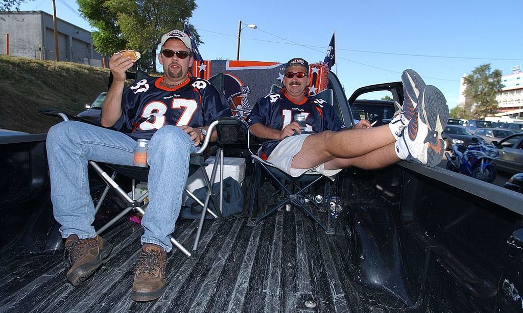 Broncos fans eating hot dogs...